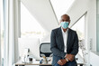 © Svitlana - Black businessman in medical mask look at camera