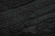 © surasak - Dark grey black slate background or texture. Black granite slabs background.