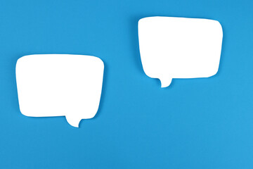 empty speech balloons on a blue background