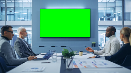 Poster - Office Conference Room Meeting using Green Screen Chroma Key TV: Multi-Ethnic Group of Top Managers, Executives Talk. Businesspeople Work on an e-Commerce Strategy.