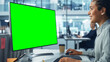 © Gorodenkoff - Diverse Corporate Office: Beautiful Black Female IT Technician Using Desktop Computer with Green Chroma Key Screen. Creative Software Engineer Work on eCommerce Project Marketing, Development
