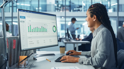 Poster - Corporate Office: Black Female IT Technician Using Desktop Computer with Big Data Statistics, Graphs. Smiling Creative Software Engineer Work on eCommerce Project Marketing, Development.