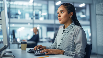 Poster - Corporate Office: Black Female IT Technician Using Desktop Computer, Uses Big Data Statistics, Graphs. Smiling Creative Software Engineer Work on eCommerce Project Marketing, Development.