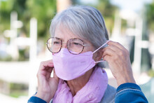 Elderly Woman Outdoors Wearing The New Most Protective Ffp2 Mask Against The Omicron Variant Of Covid-19