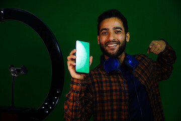 Wall Mural - man using mobile in front of the ring light