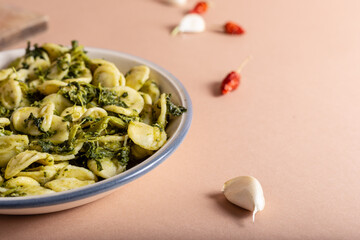 Wall Mural - Fresh orecchiette with turnip greens. Typical dish of Puglia, southern Italy. Suitable for those who follow a vegetarian diet