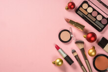 Make Up Products With Christmas Decorations At Pink. Idea For Christmas Sale And Presents. Flat Lay Image With Copy Space.