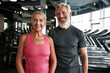 © Svitlana - Cheerful mature couple at fitness gym