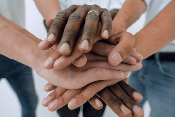 Wall Mural - Business team joining hands together