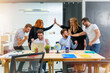 © alphaspirit - Business people are happy for the company trend and the success of the startup