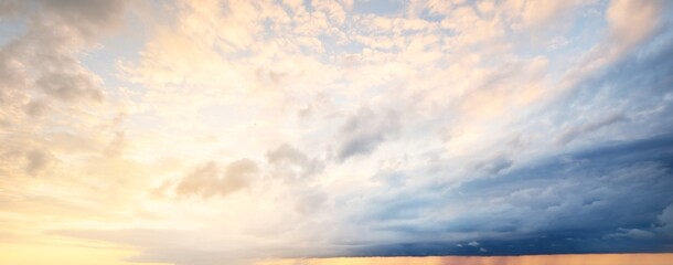 Wall Mural - Clear blue sky, red, pink, golden cirrus and cumulus clouds after storm. Dramatic sunset cloudscape. Concept art, meteorology, heaven, hope, peace, graphic resources, picturesque panoramic scenery