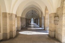 An Arched Hallway Recedes In The Distance Of A Church In Vienna Austria.