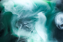 Green Smoke On Black Ink Background, Colorful Fog, Abstract Swirling Emerald Ocean Sea, Acrylic Paint Pigment Underwater