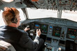 © Kostiantyn - Male pilot controlling airplane flight from cockpit