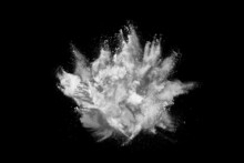 White Powder Explosion On Black Background. Colored Cloud. Colorful Dust Explode. Paint Holi.