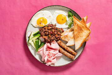 Wall Mural - traditional breakfast on the pink background