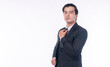 © kaew6566 - Confidence positive successful handsome businessman wear elegant suit standing on whit background. Professional smart business manager holding hand on tie over isolated.