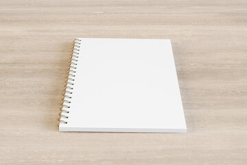 Wall Mural - Close up of blank white spiral notepad on wooden desktop background. Mock up, 3D Rendering.