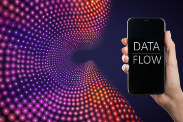 Leinwandbilder - Close up of hand holding smartphone with text on screen on creative big data flow background. Technology, cyberspace, science and digital stream concept.