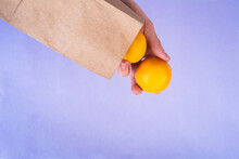 Eco Package With Lemons Inside On Very Peri Background. Zero Waste Concept. Copy Space, Go Green, Esg