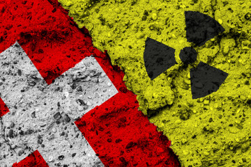 Wall Mural - Concept of the Nuclear Energy Policy of Switzerland with a flag and a radiation hazard sign painted on a rough wall