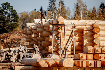 Canvas Print - Timber building house construction circle log with blue sky sun light