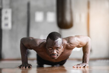 African Man Doing Push Up Exercise At The Gym. Sport Man Exercise At The Gym. Sport Concept.