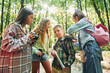 © standret - Standing together. Kids in green forest at summer daytime together