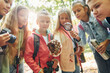 © standret - Standing together. Kids in green forest at summer daytime together