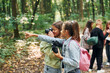 © standret - Looking for a path. Kids in green forest at summer daytime together