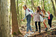 © standret - Walking on the log. Kids in green forest at summer daytime together