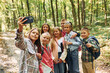 © standret - Front view. Kids in green forest at summer daytime together
