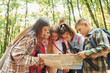 © standret - Front view. Kids in green forest at summer daytime together