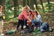 © standret - Kids in green forest at summer daytime together