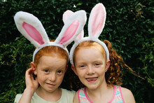 Two girls with bunny ears