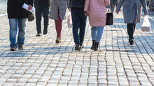 People Walking On The Street Pavement