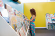 © Austockphoto - Young girl choosing a book to read at the Library