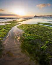 Rock Pools Streams And A Pier In The Sunrise
