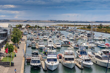 Aerial View Of Luxury Boats And Yachts Moored At A Bay Side Marina