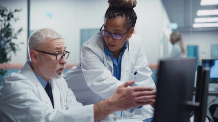 Wall Mural - Medical Hospital: Two Doctors Talk and Use Computer, Doing Test Results Analysis. Health Care Clinic Research Laboratory: Black Female Chief Surgeon and White Male General Physicial Finding Cure