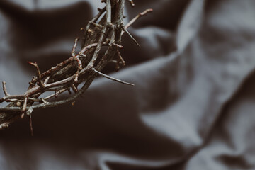 Canvas Print - Partial crown of thorns on a grey linen background with copy space