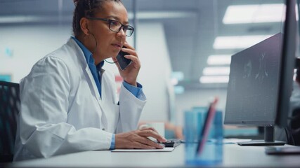 Wall Mural - Medical Hospital Research Lab: Black Female Neurosurgeon Using Computer with Brain Scan MRI Images, Talking on the Phone with Sick Patient. Health Care Neurologist Finding Treatment. Energetic Arc