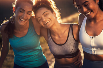 Portrait of three sporty young woman after running outdoors.