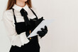 © ChesterAlive91 - Close up of a professional waitress wearing black apron taking client's orders and writing them in a notebook. Good customer service concept