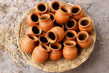 Clay Pots Kept In Baskets

