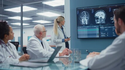 Wall Mural - Hospital Conference Meeting Room: Neurologist Shows MRI scan, Magnetic Resonance Image on TV Screen, Team of Neuroscientists, Doctors Discuss Patient Treatment, Drug Research, Medicine Development