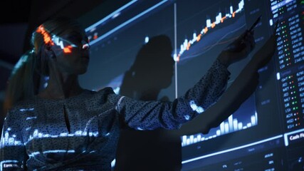 Poster - Business Conference Meeting Presentation: Businesswoman does Financial Analysis talks to Group of Businessspeople. Projector Screen Shows Stock Market Data, Investment Strategy, Revenue Growth