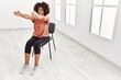 Young african american woman smiling confident stretching at sport center