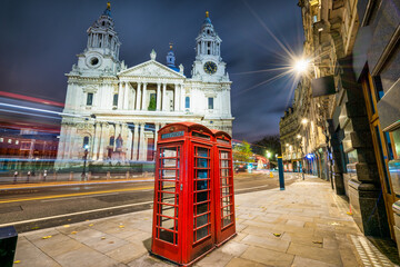 Sticker - Saint Paul's cathedral and red telephone box at night in London. England