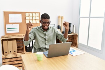 Wall Mural - Young african american man smiling confident working at office